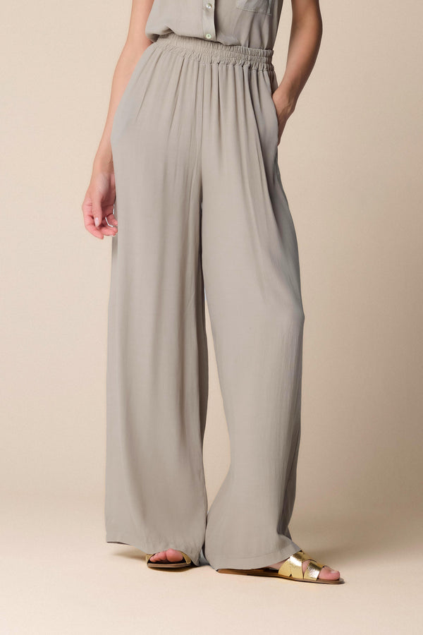 flowing grey trousers with pleated waist detailing - Trousers  ICARO