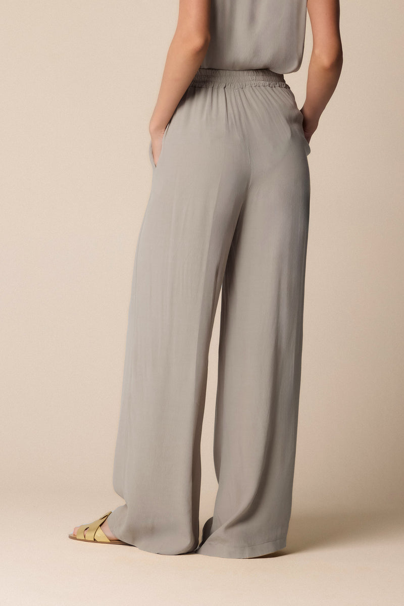 flowing grey trousers with pleated waist detailing - Trousers  ICARO